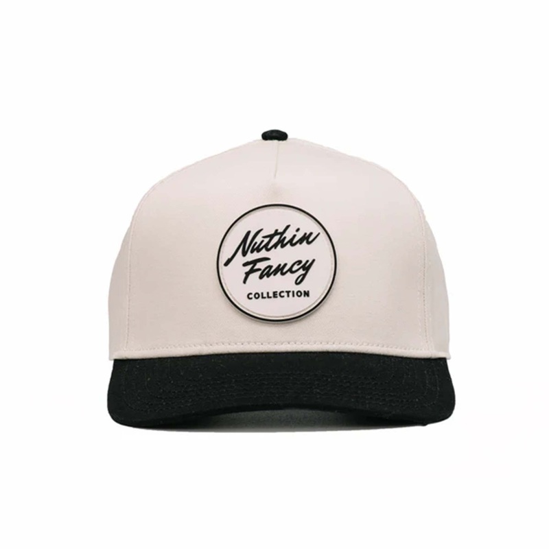 Comus Two Toned Trucker Hat in White and Black