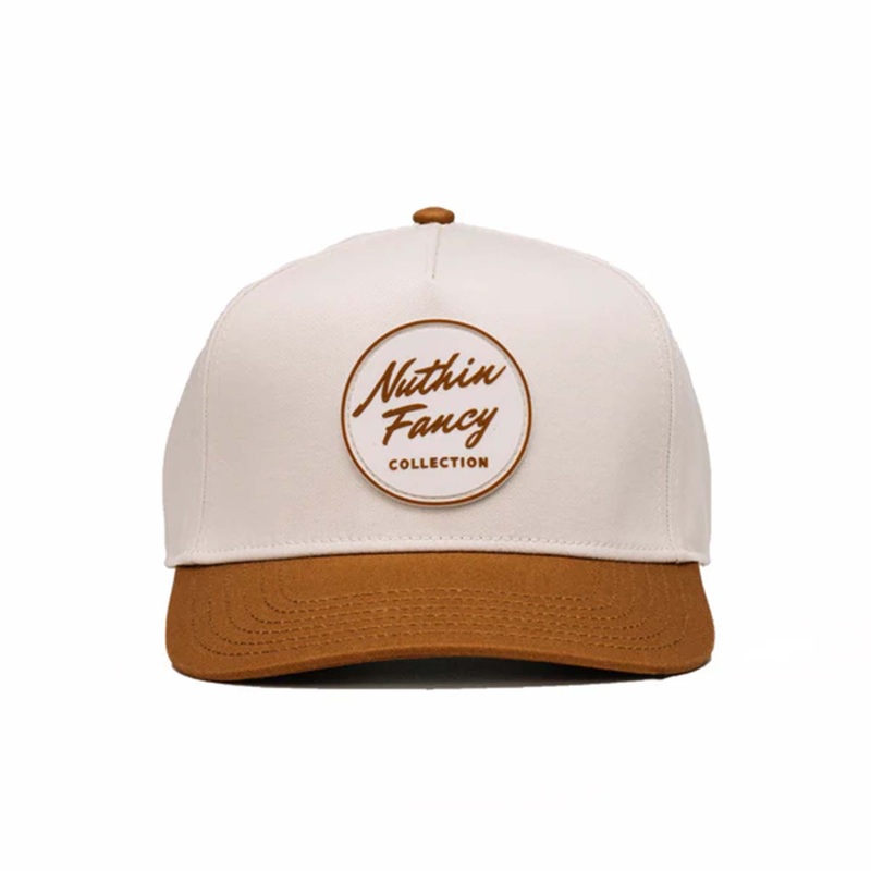 Comus Two Toned Trucker Hat in White and Rust