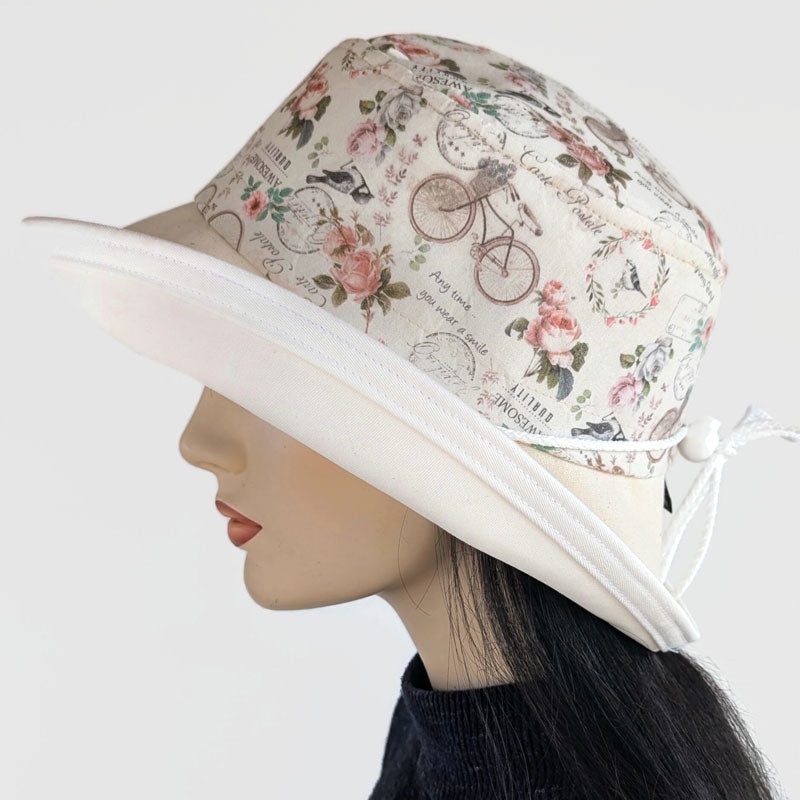 Sunblocker UV summer hat sun hat with wide brim, featuring bikes, birds, flowers, adjustable fit