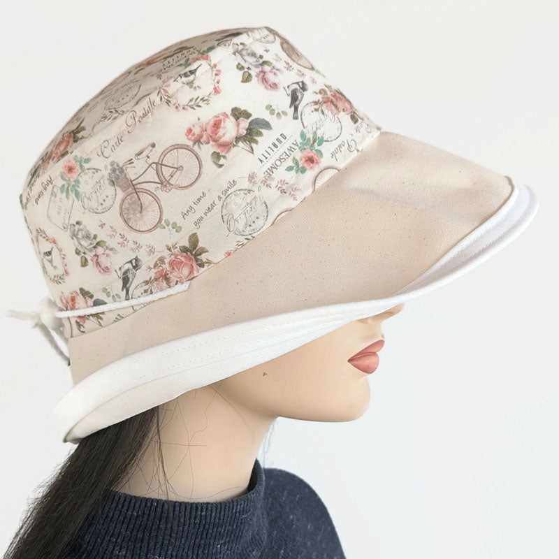 Sunblocker UV summer hat sun hat with wide brim, featuring bikes, birds, flowers, adjustable fit