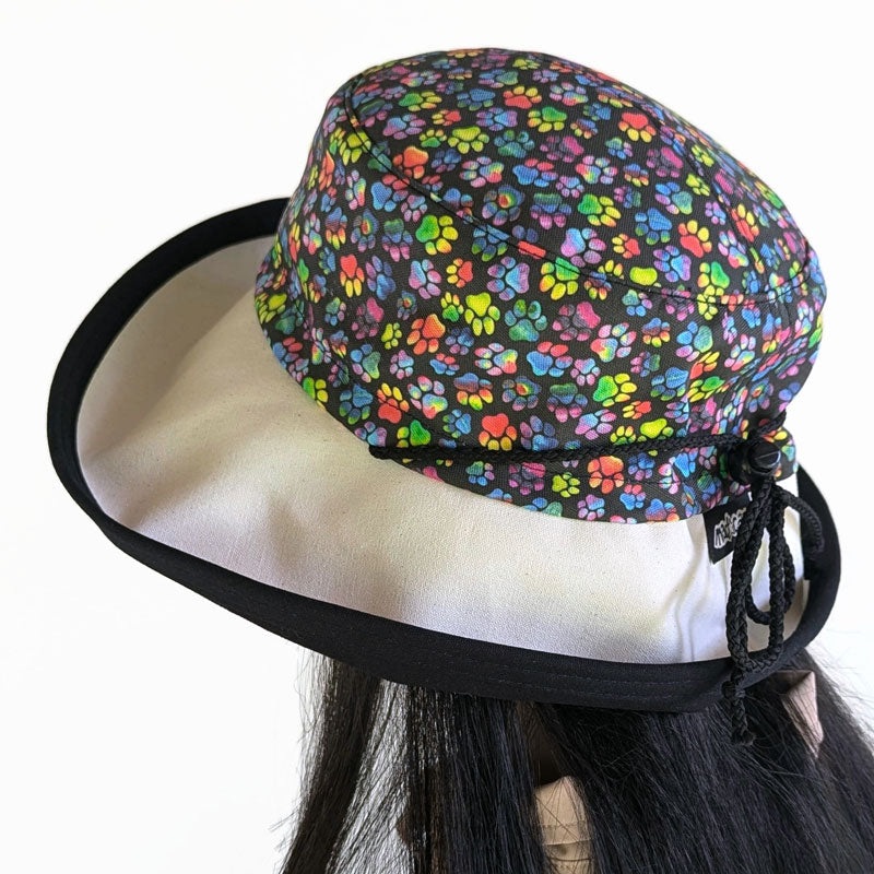 Sunblocker UV summer hat sun hat with wide brim, featuring rainbow paws print, adjustable fit