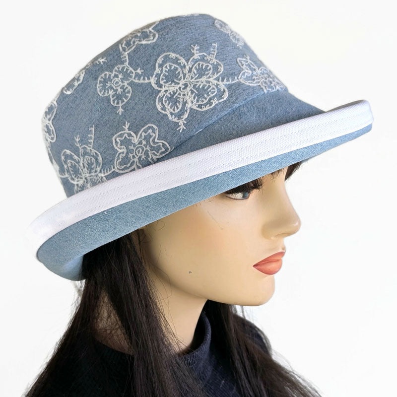 Fashion Sunblocker with wide brim and adjustable fit, bleached denim with lace overlay, adjustable fit