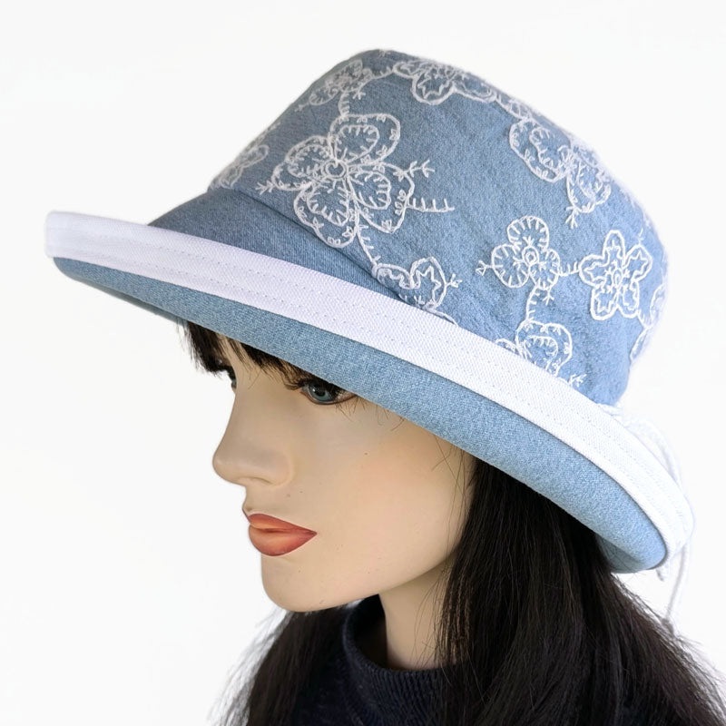 Fashion Sunblocker with wide brim and adjustable fit, bleached denim with lace overlay, adjustable fit