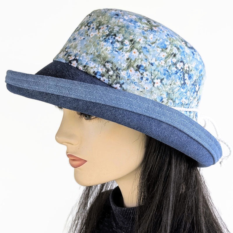 Sunblocker UV summer sun hat with wide brim, blue daisy print, adjustable fit
